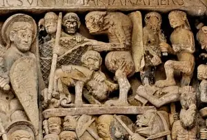 Abbés de Conques pris dans les filets du diable sur le tympan